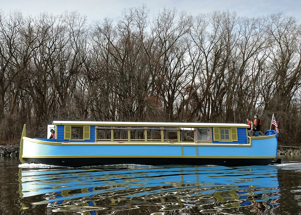 Scarano-built 54-foot 19th century-style canal boat historic replica out on water with passengers